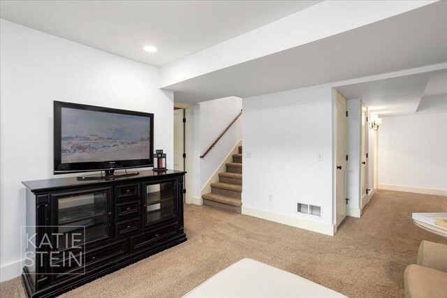 859 Orchard Ave SE, East Grand Rapids, MI 49506 - living area featuring carpet flooring, stairs, and recessed lighting