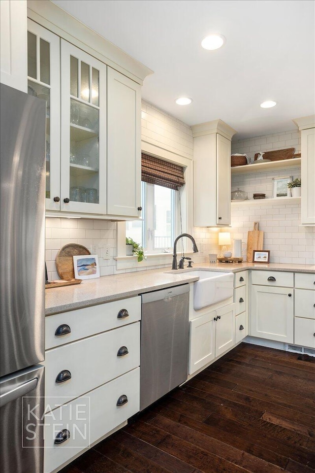 859 Orchard Ave SE, East Grand Rapids, MI 49506 - kitchen featuring stainless steel appliances, dark wood-style flooring, decorative backsplash, open shelves, and recessed lighting