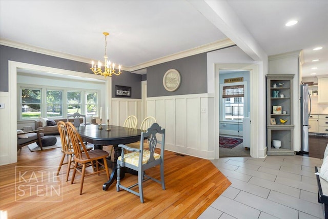 859 Orchard Ave SE, East Grand Rapids, MI 49506 - dining area featuring a chandelier, ornamental molding, a wainscoted wall, a decorative wall, and recessed lighting