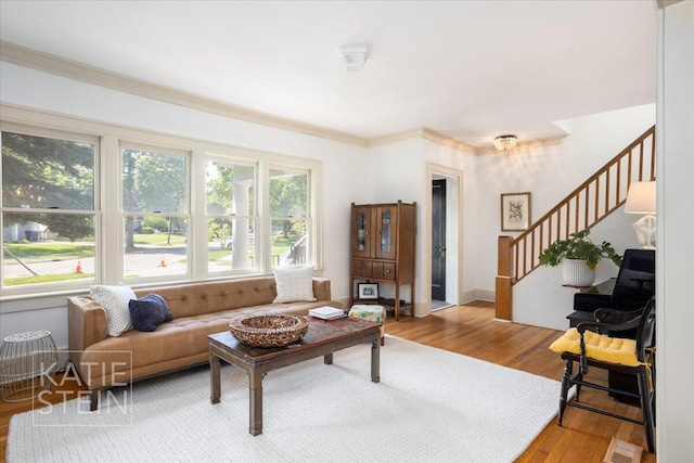 859 Orchard Ave SE, East Grand Rapids, MI 49506 - living area featuring stairs, wood finished floors, and crown molding