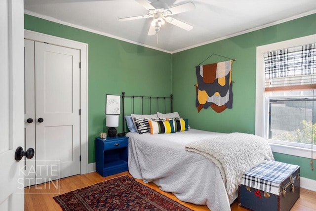 859 Orchard Ave SE, East Grand Rapids, MI 49506 - bedroom featuring wood finished floors, crown molding, and a ceiling fan