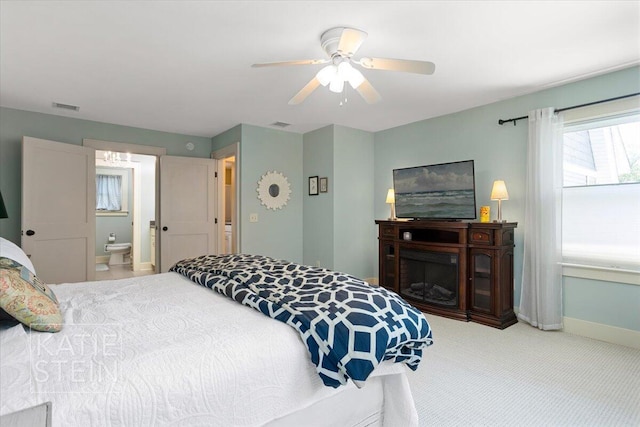 859 Orchard Ave SE, East Grand Rapids, MI 49506 - bedroom with carpet, ceiling fan, and connected bathroom