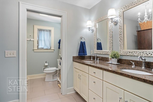 859 Orchard Ave SE, East Grand Rapids, MI 49506 - full bath featuring double vanity and tile patterned flooring