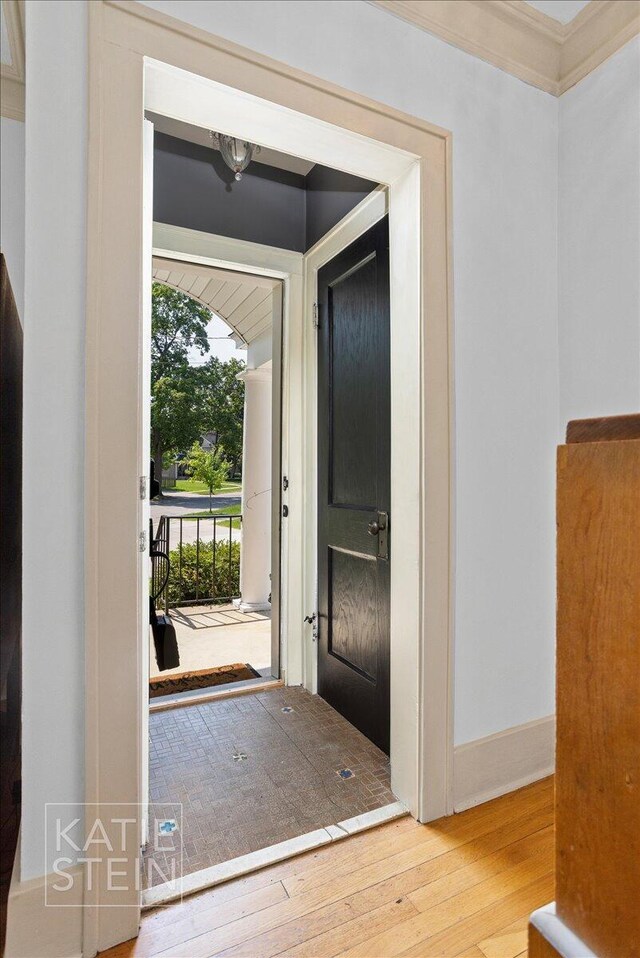859 Orchard Ave SE, East Grand Rapids, MI 49506 - entrance foyer featuring hardwood / wood-style flooring and crown molding