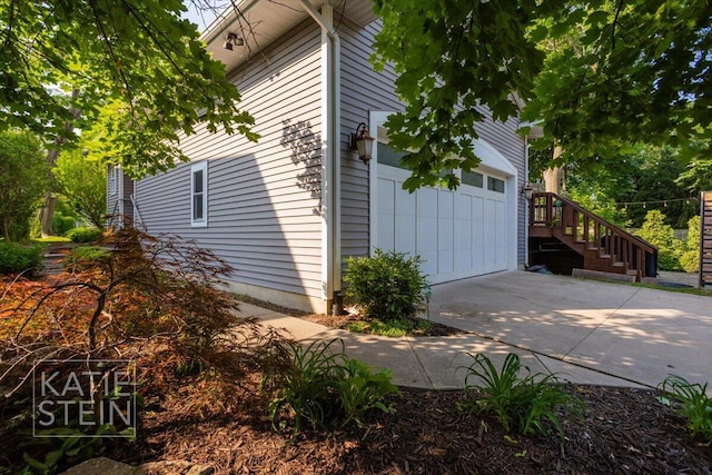 859 Orchard Ave SE, East Grand Rapids, MI 49506 - view of home's exterior with a garage and driveway