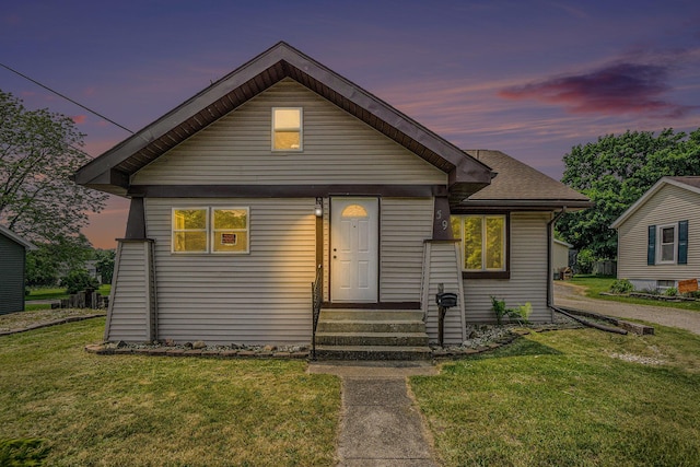 59 Dunning Ave, Battle Creek, MI 49037 - bungalow-style house with entry steps and a lawn