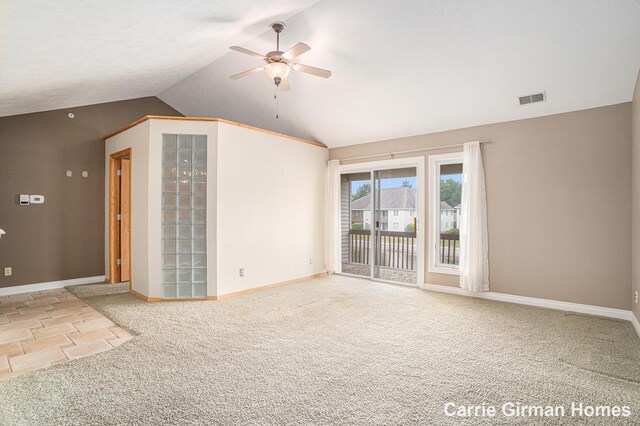 3089 E Crystal Waters Dr Unit 7, Holland, MI 49424 - carpeted spare room with a ceiling fan and vaulted ceiling