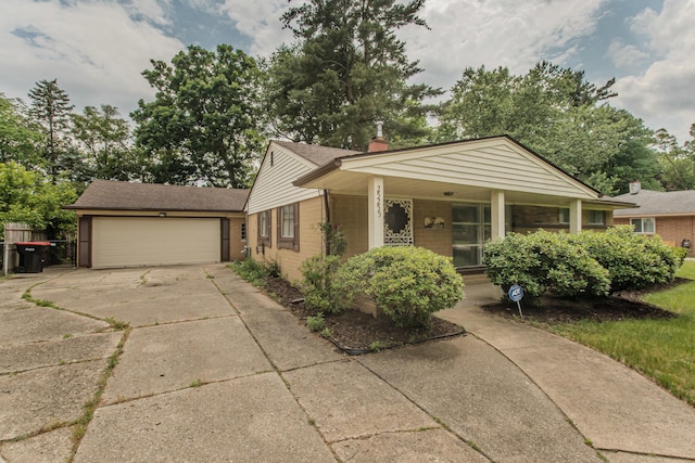 25255 Orchard Grove St, Southfield, MI 48033 - view of front of house featuring driveway, an attached garage, roof with shingles, and a porch