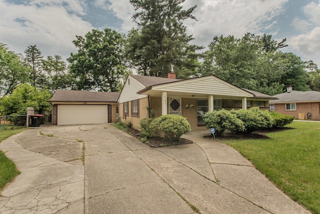 25255 Orchard Grove St, Southfield, MI 48033 - view of front facade with driveway, an attached garage, a front lawn, brick siding, and a chimney