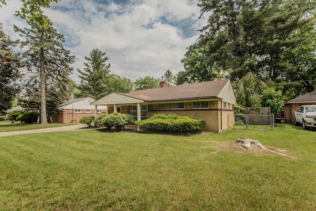 25255 Orchard Grove St, Southfield, MI 48033 - ranch-style house with brick siding, a chimney, driveway, and roof with shingles