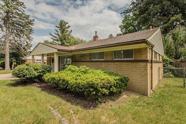 25255 Orchard Grove St, Southfield, MI 48033 - view of front of property with a chimney and brick siding