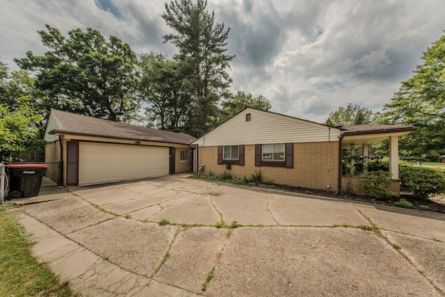 25255 Orchard Grove St, Southfield, MI 48033 - view of front of property with brick siding, concrete driveway, and an attached garage