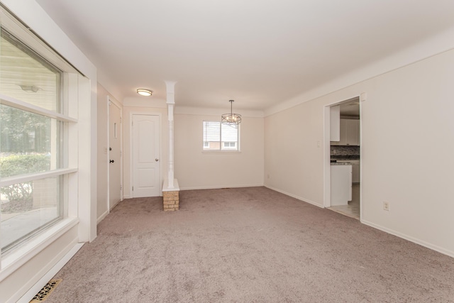 25255 Orchard Grove St, Southfield, MI 48033 - empty room with a chandelier and light carpet