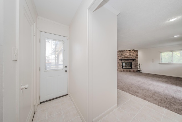 25255 Orchard Grove St, Southfield, MI 48033 - doorway to outside featuring light carpet, light tile patterned floors, a fireplace, and crown molding