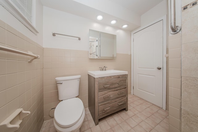 25255 Orchard Grove St, Southfield, MI 48033 - half bathroom featuring tile walls, tile patterned floors, vanity, recessed lighting, and wainscoting
