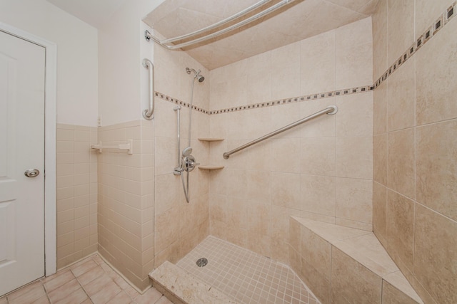 25255 Orchard Grove St, Southfield, MI 48033 - full bath with a tile shower, tile walls, and tile patterned floors