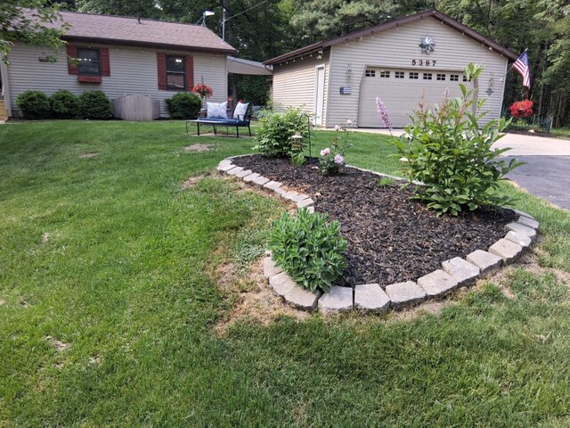 5397 E 80th St, Newaygo, MI 49337 - view of grassy yard with a garage