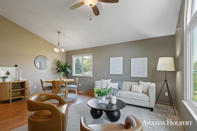 430 6th St NE, Cedar Springs, MI 49319 - living area with lofted ceiling, wood finished floors, and a ceiling fan