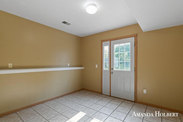 430 6th St NE, Cedar Springs, MI 49319 - doorway with baseboards and light tile patterned flooring