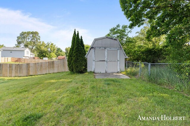 430 6th St NE, Cedar Springs, MI 49319 - fenced backyard featuring a storage shed