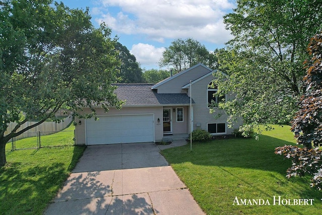 430 6th St NE, Cedar Springs, MI 49319 - tri-level home with an attached garage, driveway, and roof with shingles