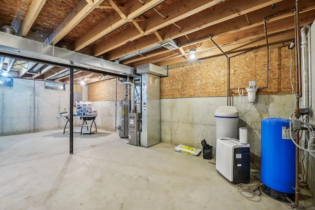8280 Frederick St, Salem, MI 48175 - unfinished basement featuring a water pressure tank, gas water heater, and heating unit