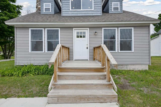 313 E Main St, Marion, MI 49665 - view of front facade featuring roof with shingles