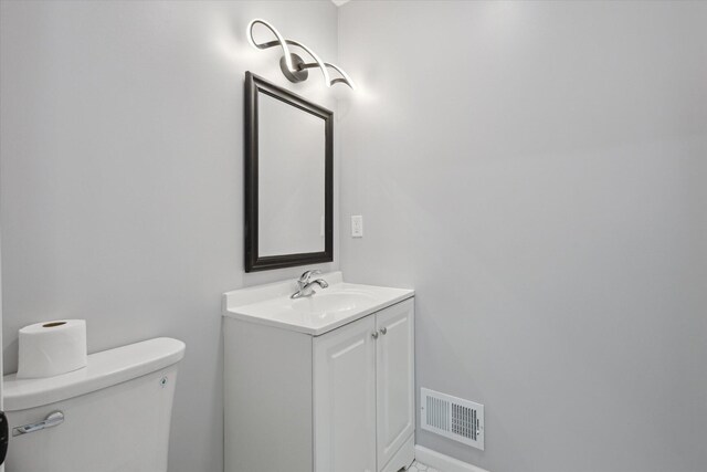 313 E Main St, Marion, MI 49665 - half bathroom with toilet and vanity
