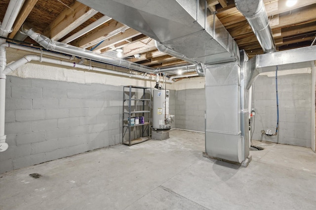 313 E Main St, Marion, MI 49665 - unfinished below grade area with water heater and heating unit