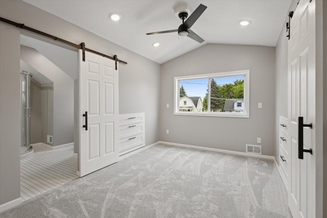 313 E Main St, Marion, MI 49665 - unfurnished bedroom with a barn door, light carpet, vaulted ceiling, a ceiling fan, and recessed lighting