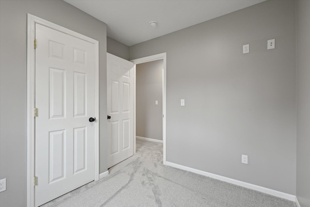 313 E Main St, Marion, MI 49665 - unfurnished bedroom with carpet floors and baseboards