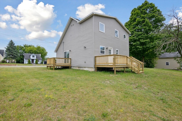 313 E Main St, Marion, MI 49665 - back of house with a wooden deck and a yard