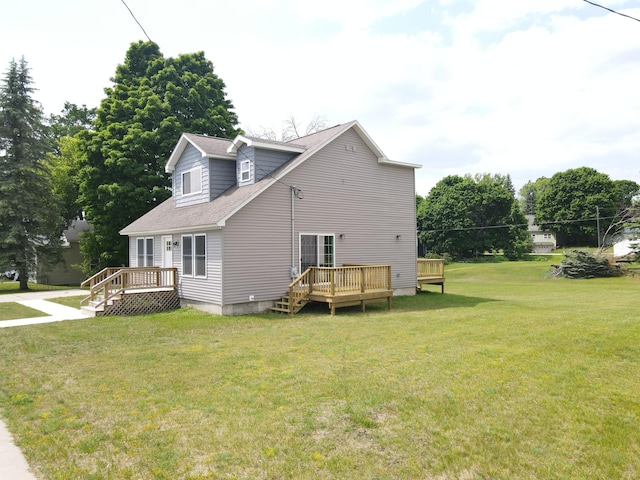 313 E Main St, Marion, MI 49665 - view of home's exterior featuring a wooden deck, a yard, and a shingled roof