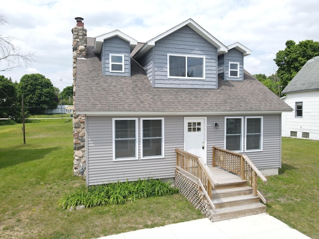313 E Main St, Marion, MI 49665 - view of front of property featuring a chimney, a front yard, and roof with shingles