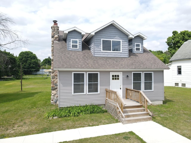 313 E Main St, Marion, MI 49665 - view of front facade featuring a chimney, a front lawn, and a shingled roof