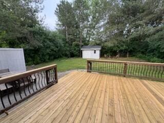5689 Rothbury Ct, Ypsilanti, MI 48197 - wooden deck with a storage shed and a lawn