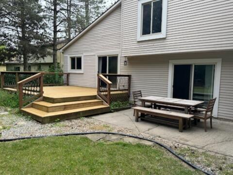 5689 Rothbury Ct, Ypsilanti, MI 48197 - back of house with a deck, a patio, and outdoor dining area