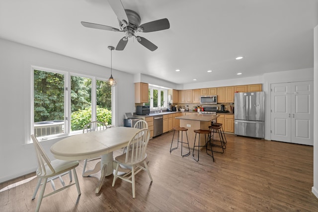 7624 Quail Ridge Dr, Dexter, MI 48130 - dining area featuring recessed lighting, wood finished floors, and ceiling fan