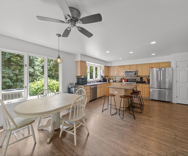 7624 Quail Ridge Dr, Dexter, MI 48130 - dining area featuring recessed lighting, wood finished floors, and a ceiling fan