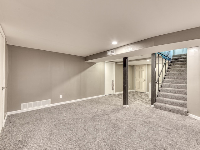 219 Park St, Tecumseh, MI 49286 - finished below grade area with carpet floors, stairway, and recessed lighting
