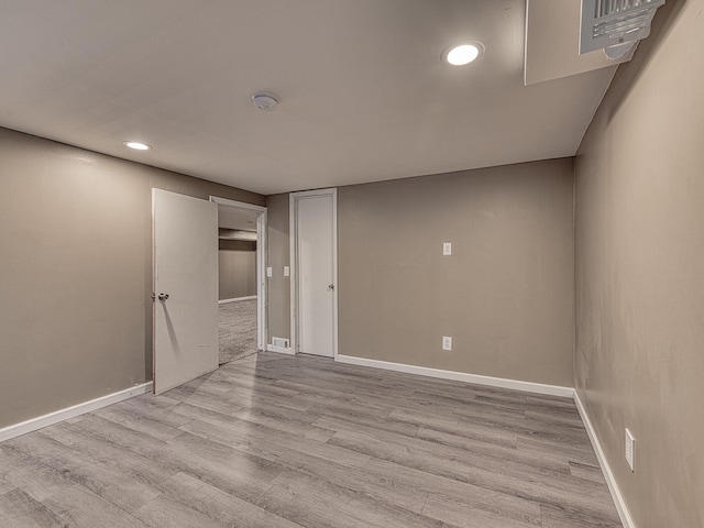 219 Park St, Tecumseh, MI 49286 - unfurnished room with wood finished floors, a smoke detector, and recessed lighting