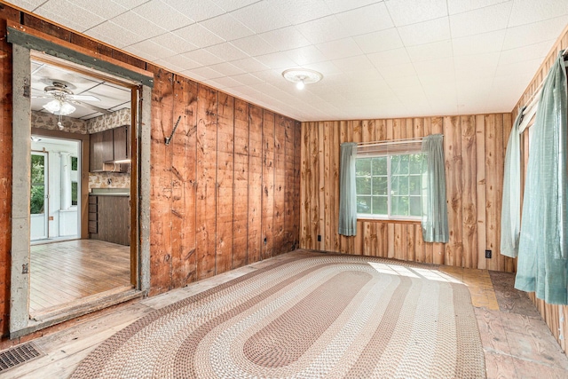 20821 J Dr N, Marshall, MI 49068 - unfurnished room featuring plenty of natural light, ceiling fan, and wooden walls