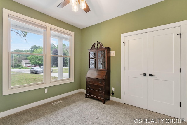 13407 152nd Ave, Grand Haven, MI 49417 - bedroom featuring light colored carpet, a closet, and ceiling fan