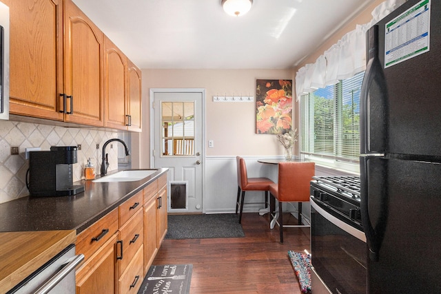 1198 Hawthorne Ave, Ypsilanti, MI 48198 - kitchen featuring freestanding refrigerator, gas range, healthy amount of natural light, and tasteful backsplash