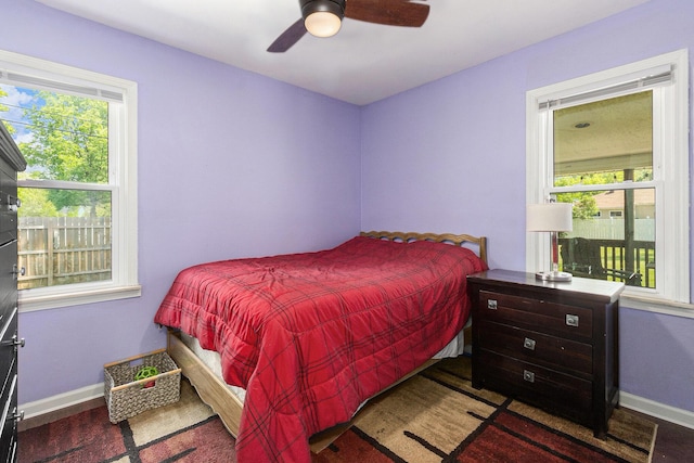 1198 Hawthorne Ave, Ypsilanti, MI 48198 - bedroom with multiple windows, wood finished floors, and a ceiling fan
