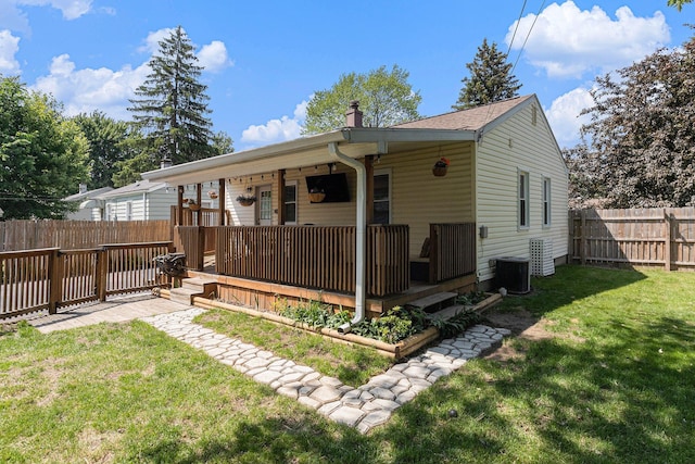 1198 Hawthorne Ave, Ypsilanti, MI 48198 - back of house with a fenced backyard and a chimney
