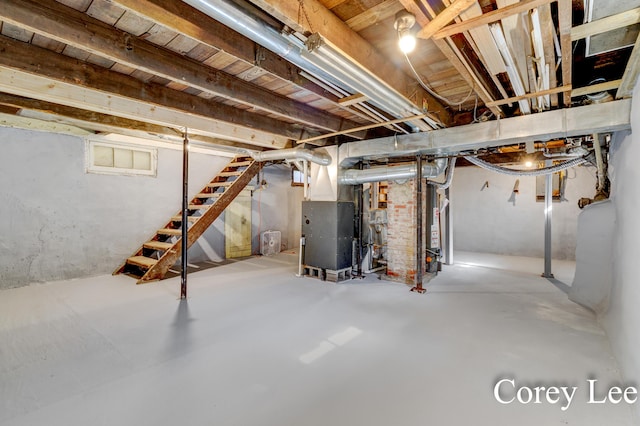 413 W Riverside Dr, Ionia, MI 48846 - unfinished basement featuring stairs and heating unit