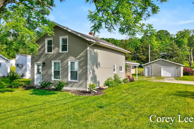 413 W Riverside Dr, Ionia, MI 48846 - view of front of home with a detached garage, an outbuilding, driveway, a chimney, and a front yard