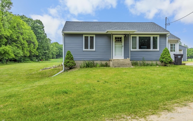 595 133rd Ave, Wayland, MI 49348 - view of front facade featuring a front yard and roof with shingles