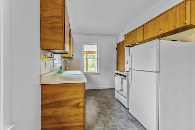 595 133rd Ave, Wayland, MI 49348 - kitchen featuring white appliances, brown cabinetry, and light countertops